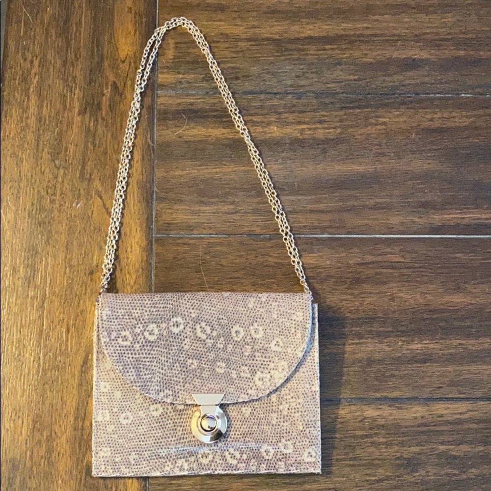 Lauren Merkin gold leather chain strap clutch.